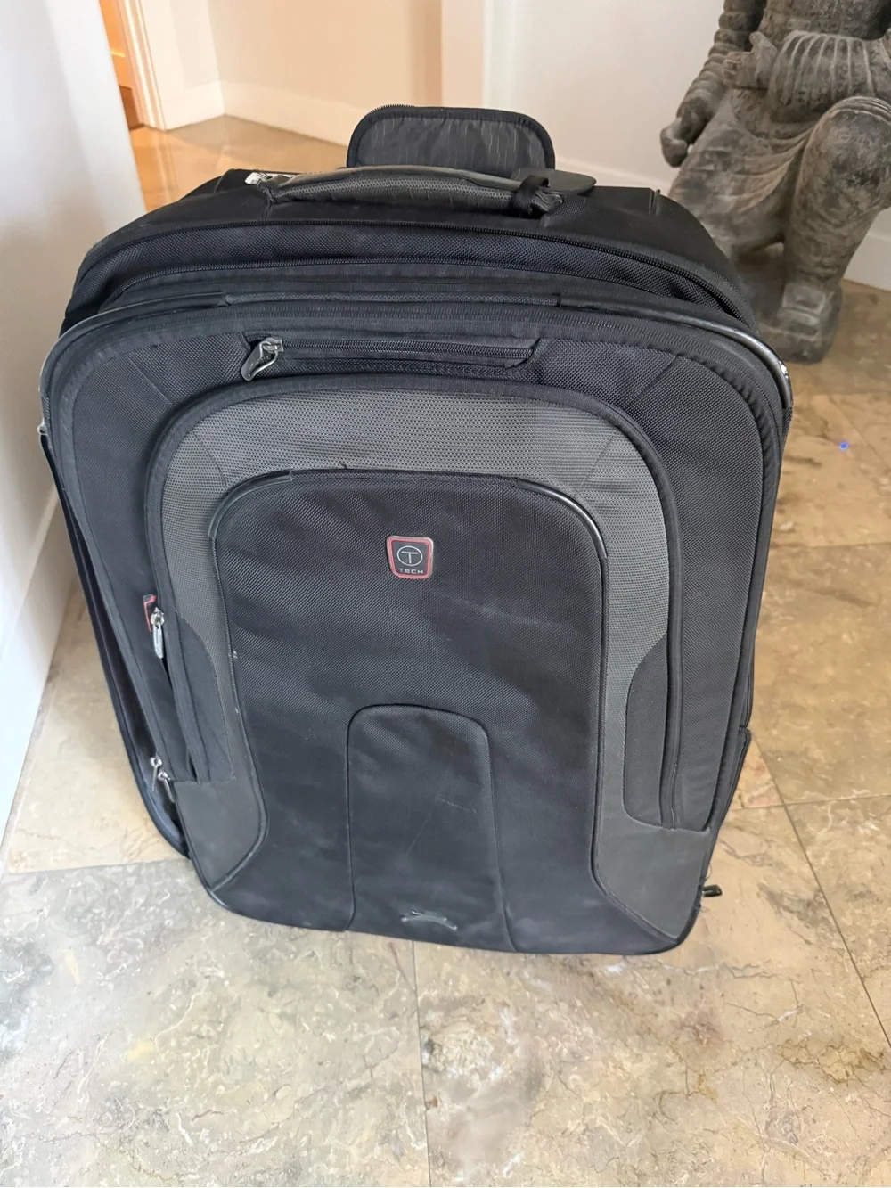 Tumi Black and Gray Rolling Carry-On